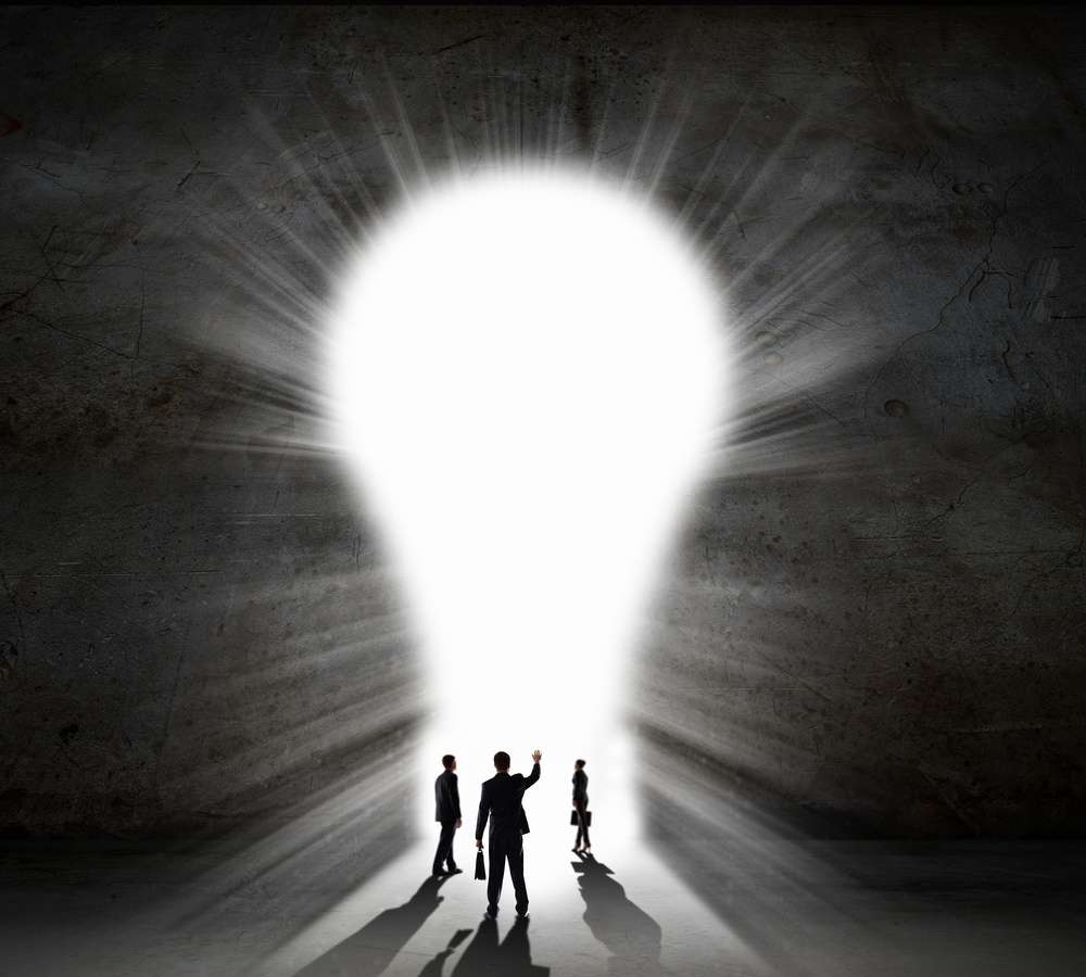 Silhouette of businesspeople against black wall. Idea concept